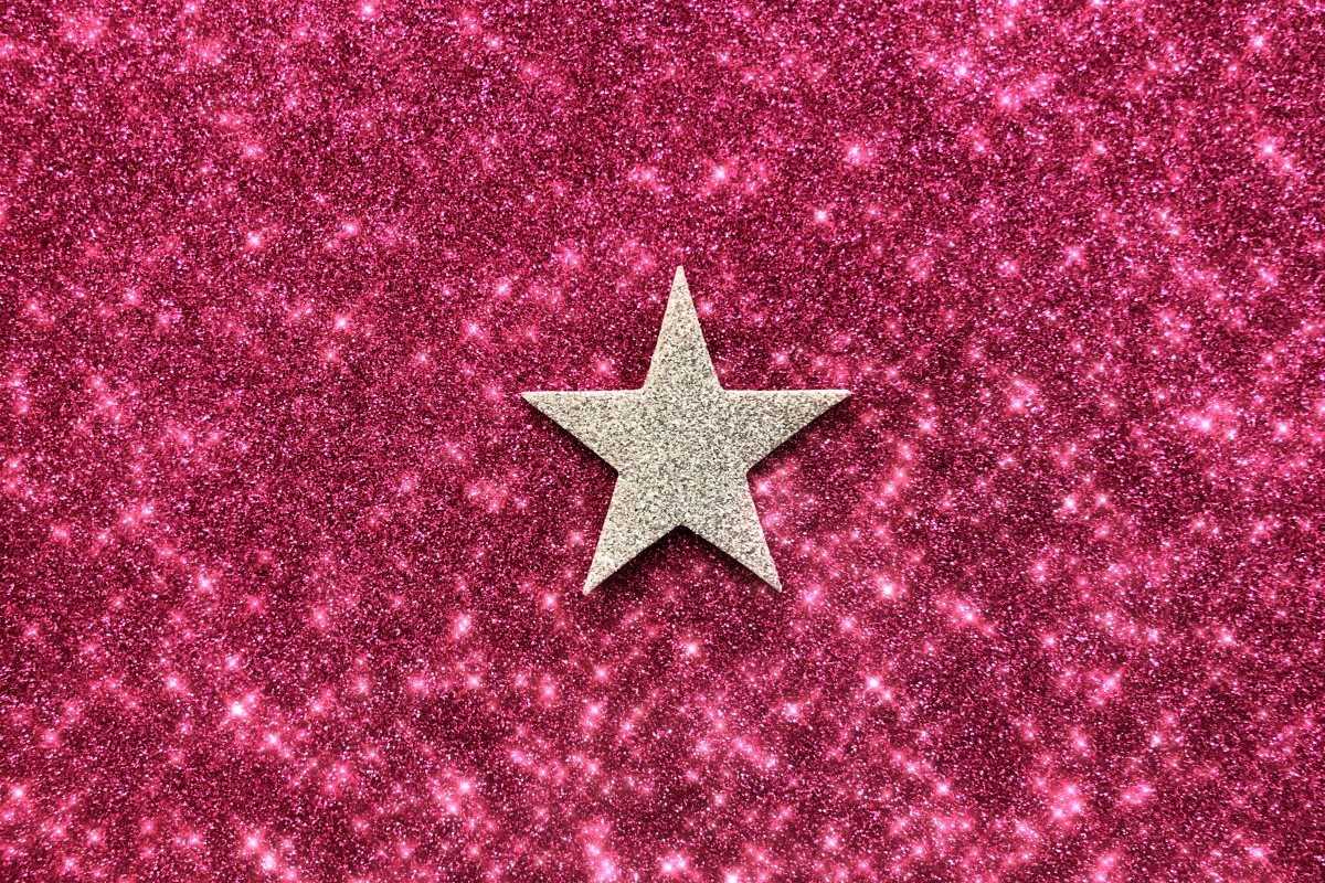 Gold Star on Pink Glitter Background